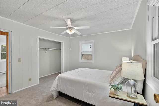 a bathroom with a sink toilet and mirror