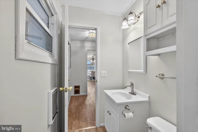 a en suite bathroom with a toilet sink and mirror