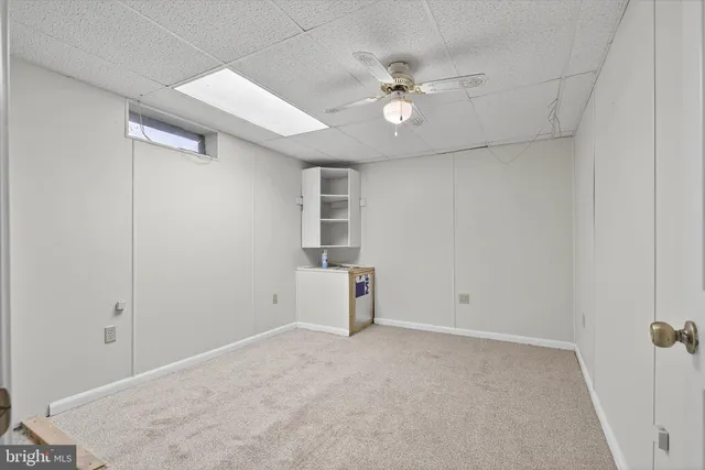 a view of an empty room with brick wall and closet