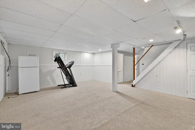 a view of a house with backyard and porch