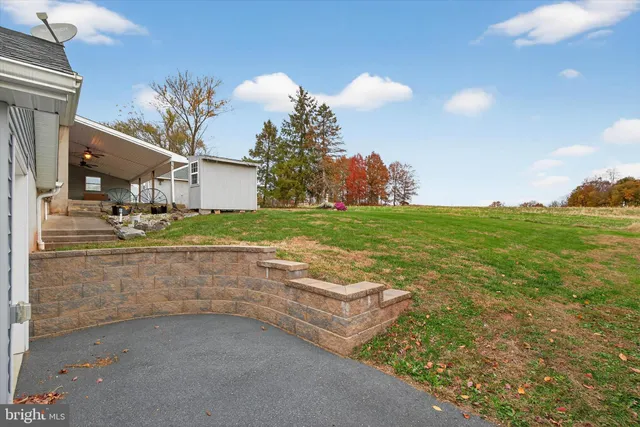 a view of a livingroom with a patio and a fireplace