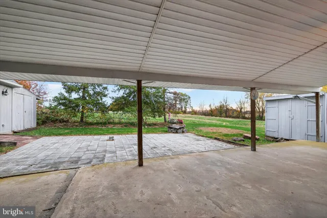 a house view with a sitting space and garden