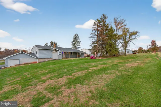 an aerial view of a house with outdoor space