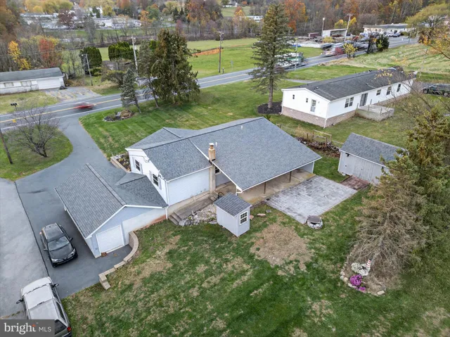 an aerial view of a house with garden view