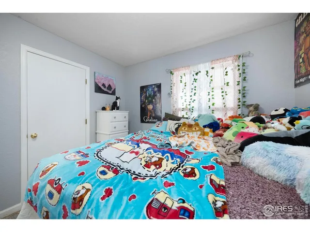 a bedroom with a bed and a table in it