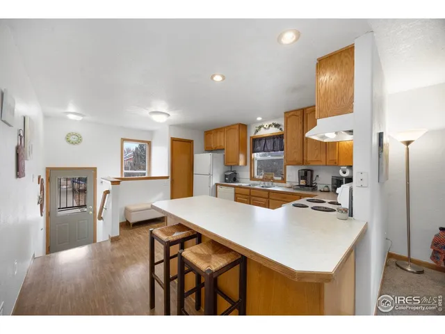 a kitchen with cabinets a sink and appliances