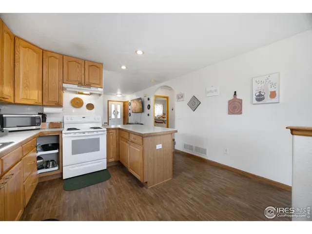 a kitchen with a refrigerator and a sink