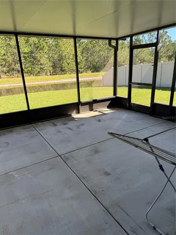 a view of an empty room with a large window