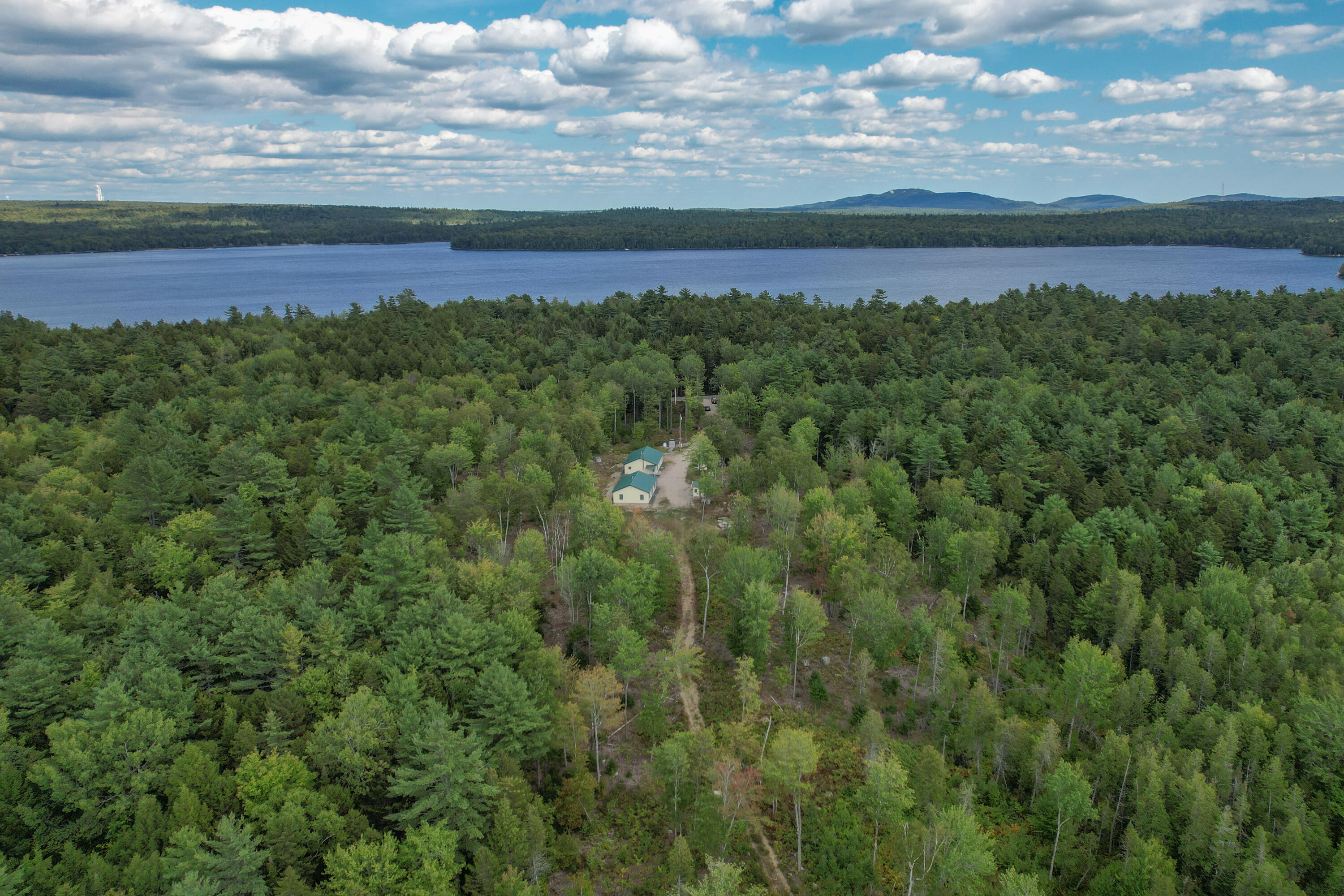 940 Macomber Mill Road Eastbrook, ME 04634 - Photo 46 of 62 Aerial with pond in distance