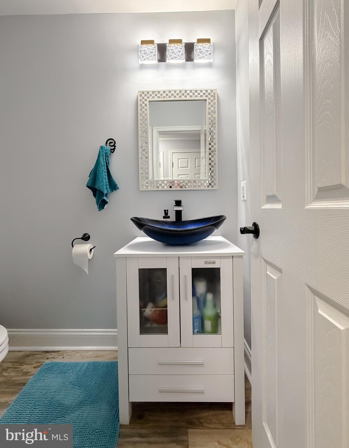 30150 Huntt Road Mechanicsville, MD 20659 - Photo 22 of 40 a bathroom with a sink and a mirror