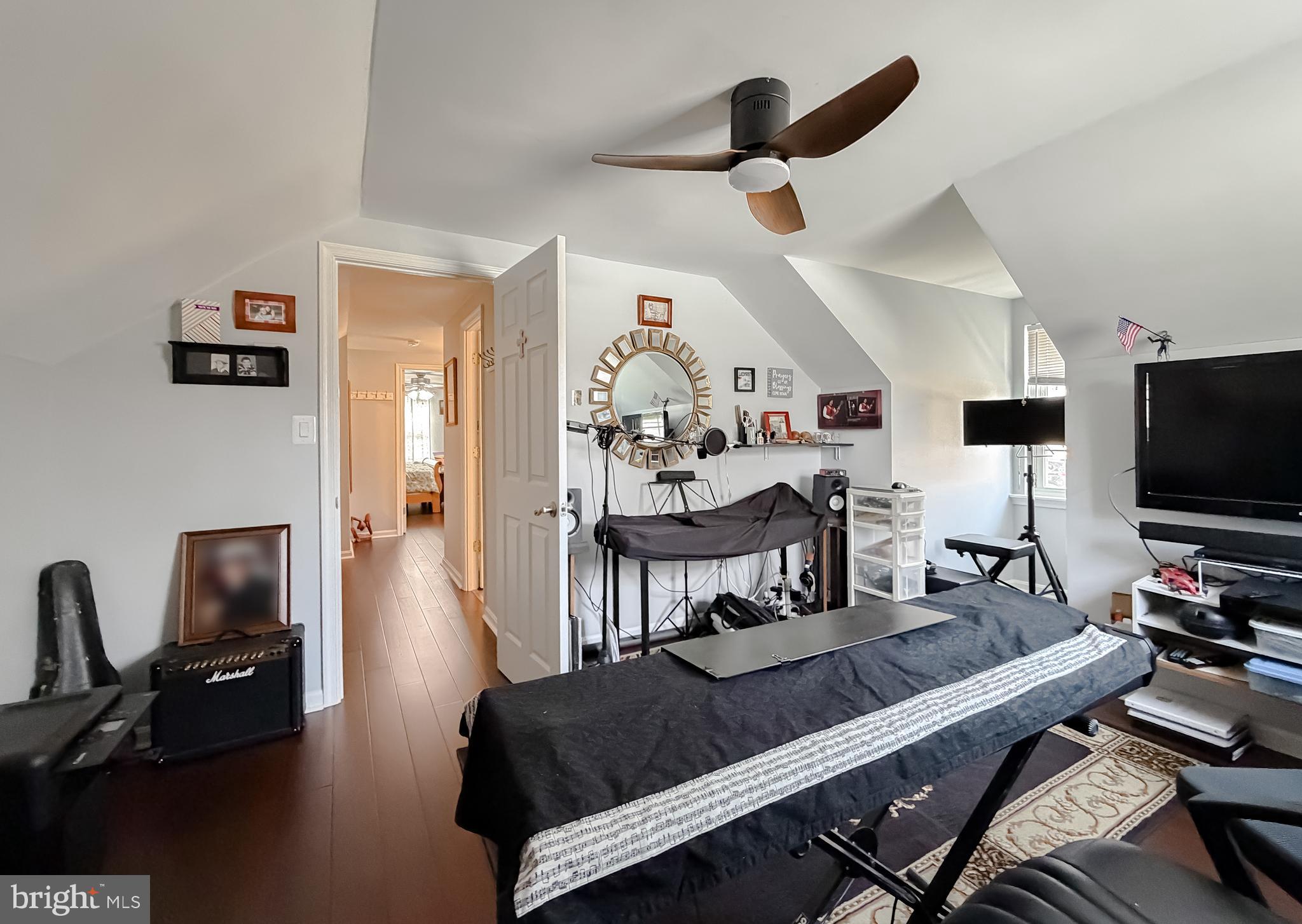 30150 Huntt Road Mechanicsville, MD 20659 - Photo 36 of 40 a living room with furniture and a flat screen tv