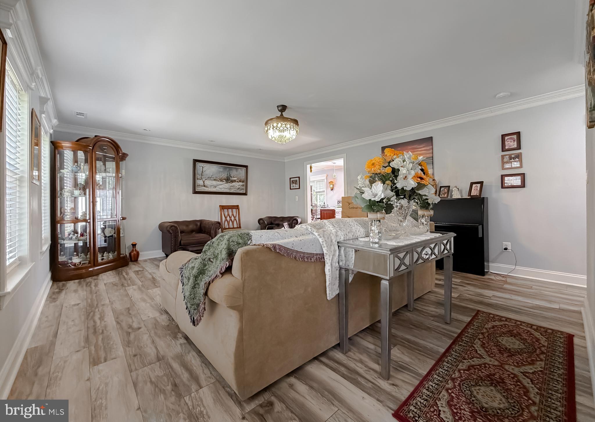 30150 Huntt Road Mechanicsville, MD 20659 - Photo 8 of 40 a living room with furniture and a flat screen tv