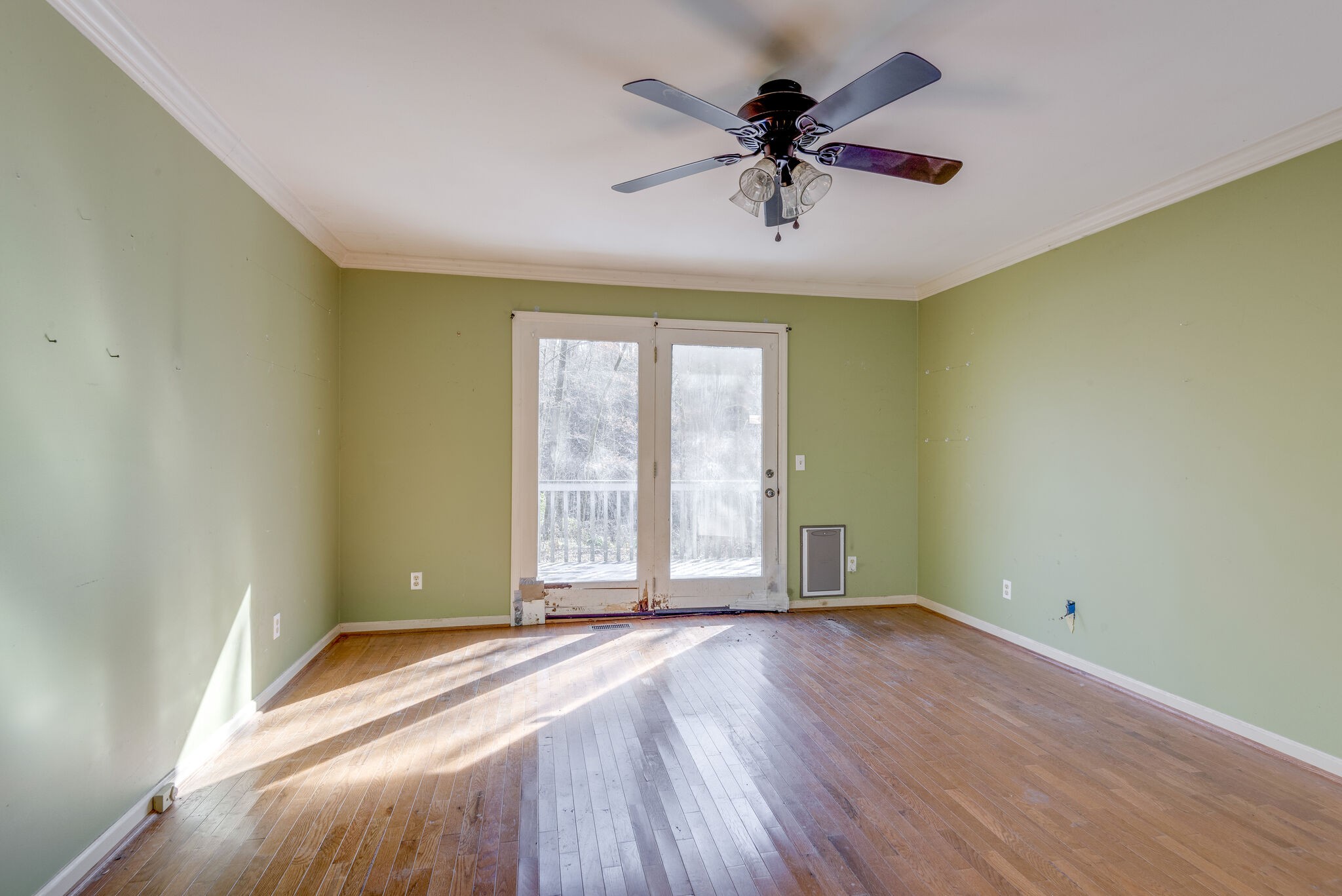 7393 Walker Road Fairview, TN 37062 - Photo 14 of 25 an empty room with wooden floor and windows