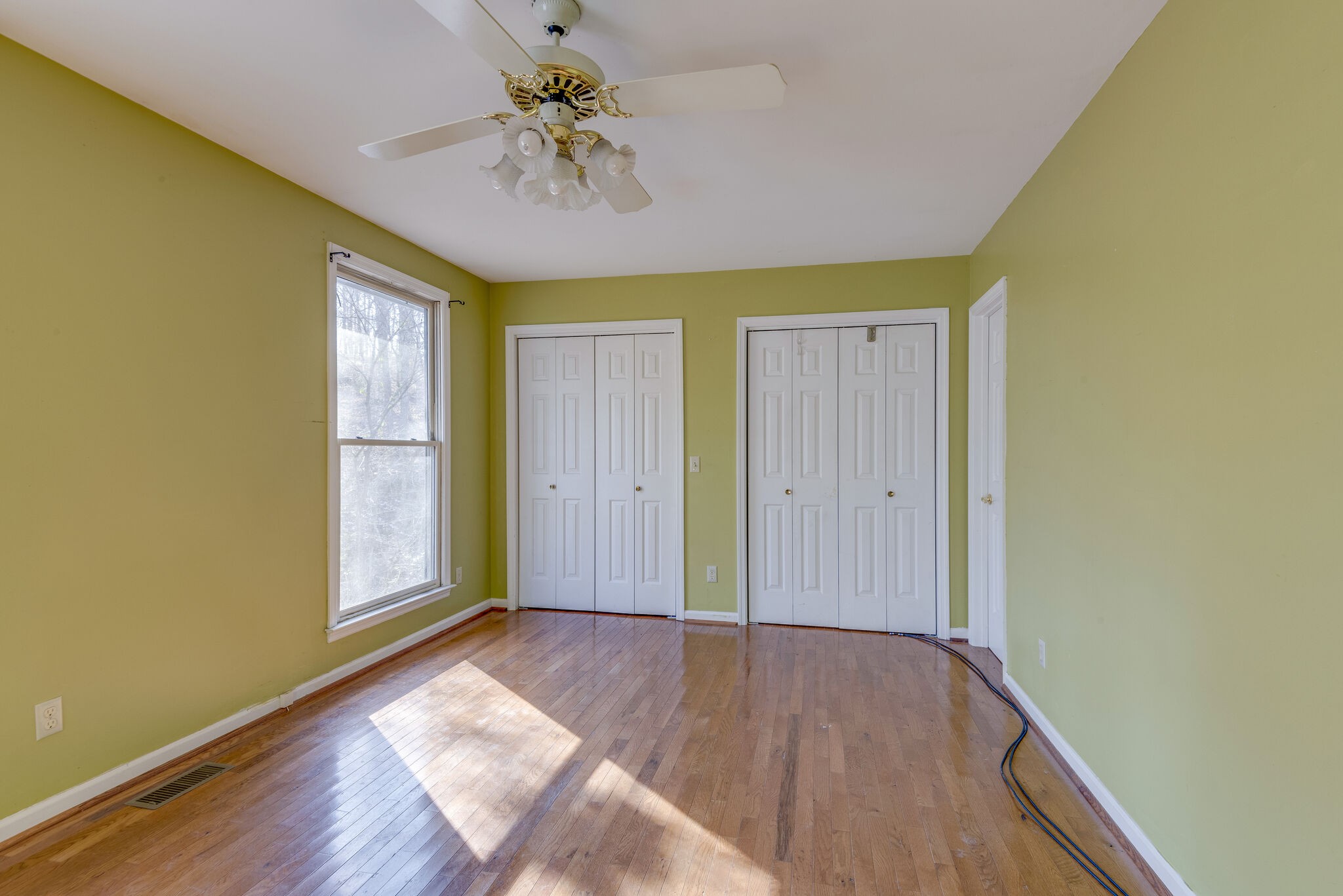 7393 Walker Road Fairview, TN 37062 - Photo 18 of 25 wooden floor in an empty room with a window