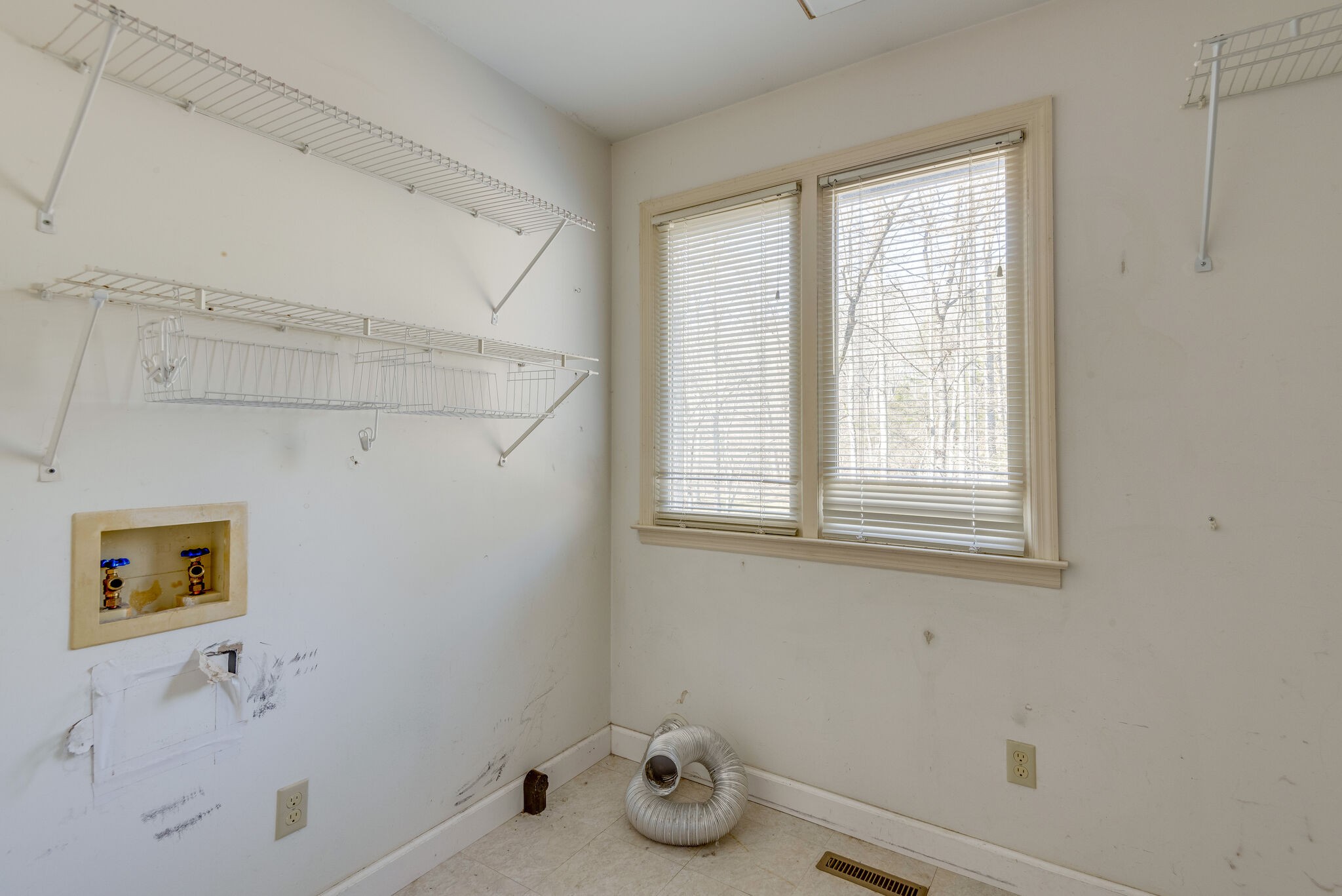 7393 Walker Road Fairview, TN 37062 - Photo 20 of 25 a bathroom with a window and cabinets