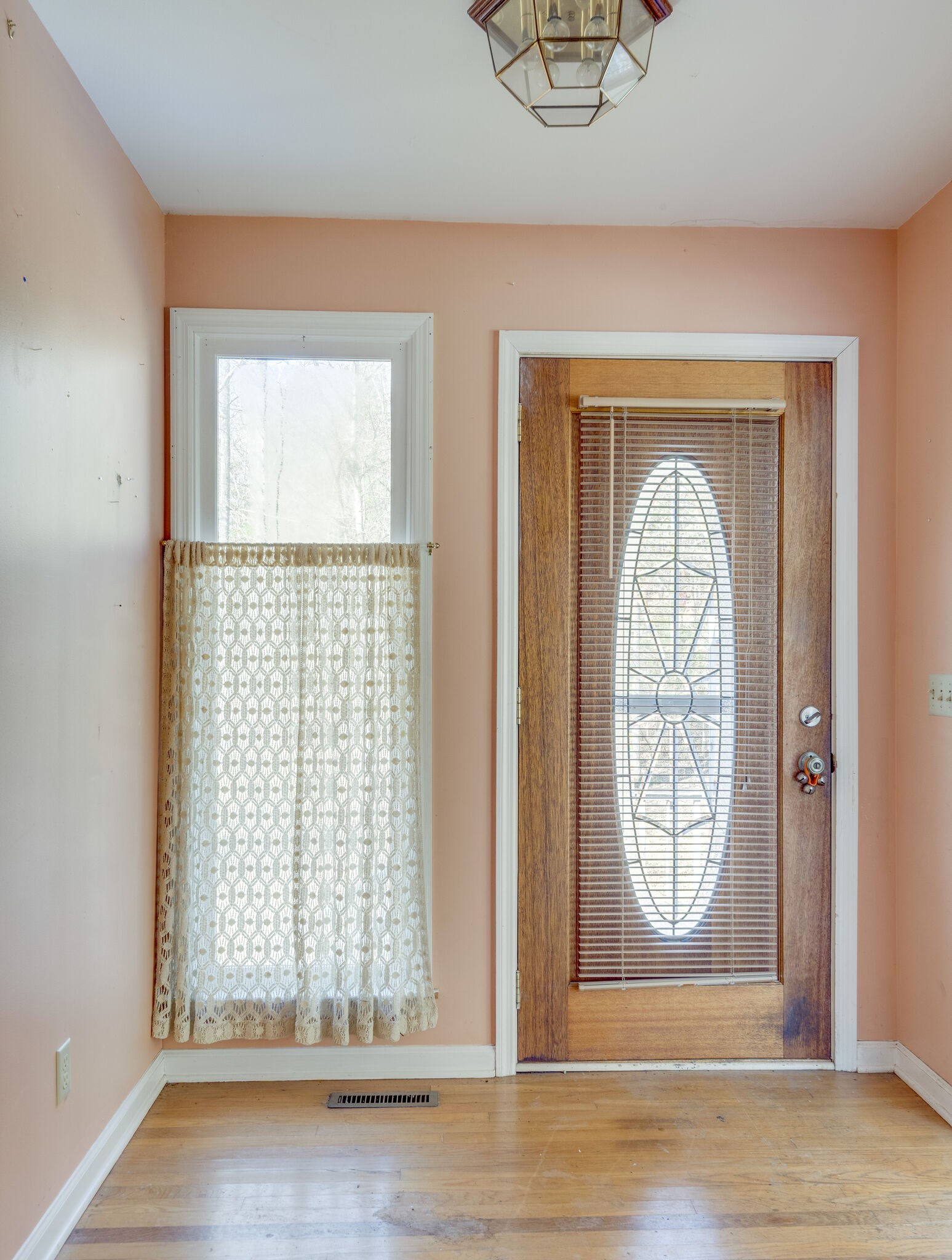7393 Walker Road Fairview, TN 37062 - Photo 5 of 25 an empty room with wooden floor windows and outdoor view