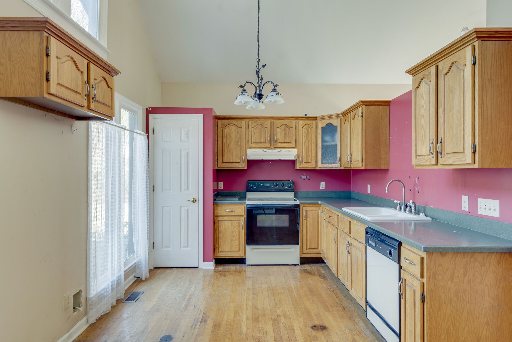 7393 Walker Road Fairview, TN 37062 - Photo 7 of 25 a kitchen with stainless steel appliances granite countertop a stove a sink dishwasher and a refrigerator