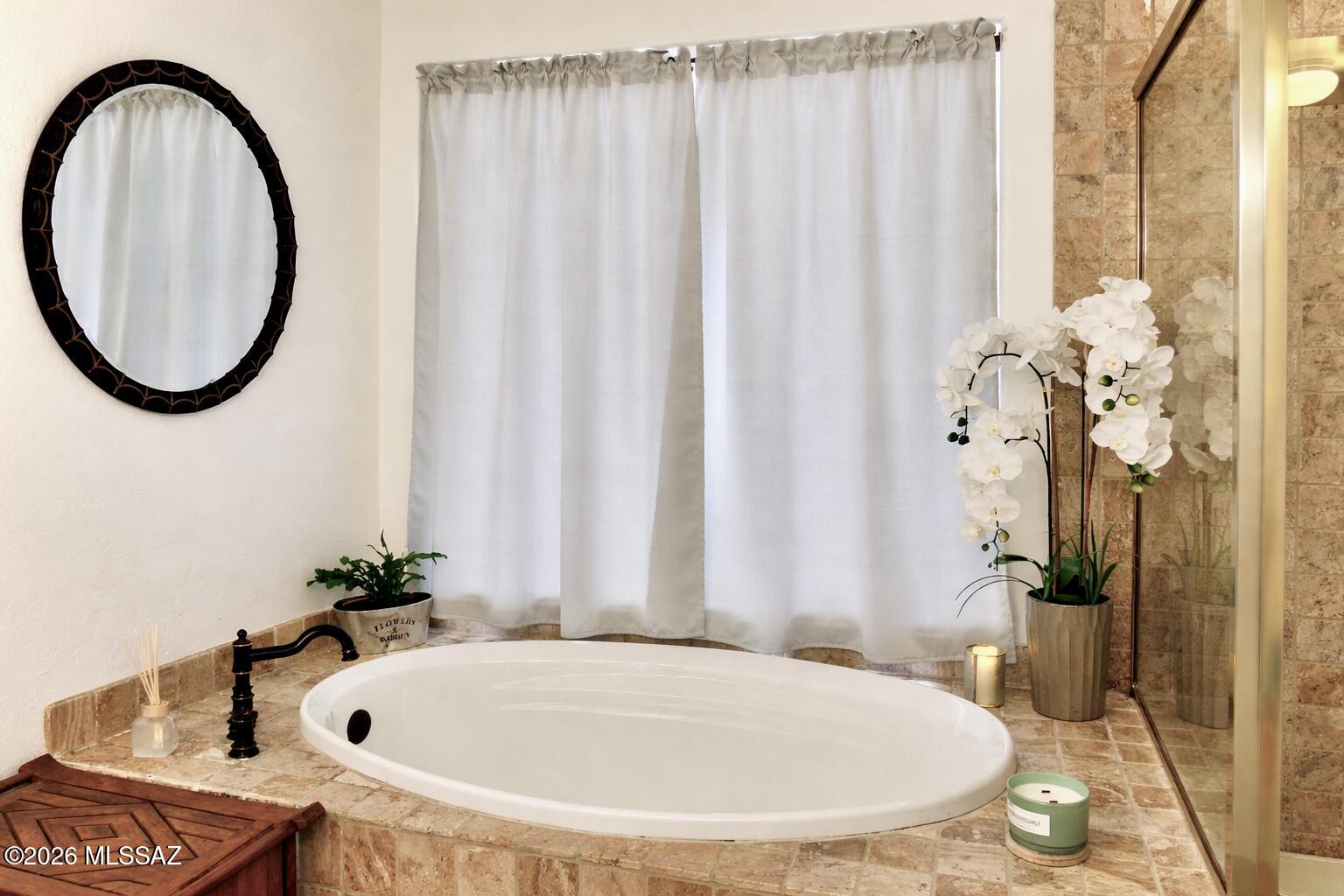 5202 Spring View Drive Tucson, AZ 85749 - Photo 32 of 49 a bathroom with a sink and a mirror