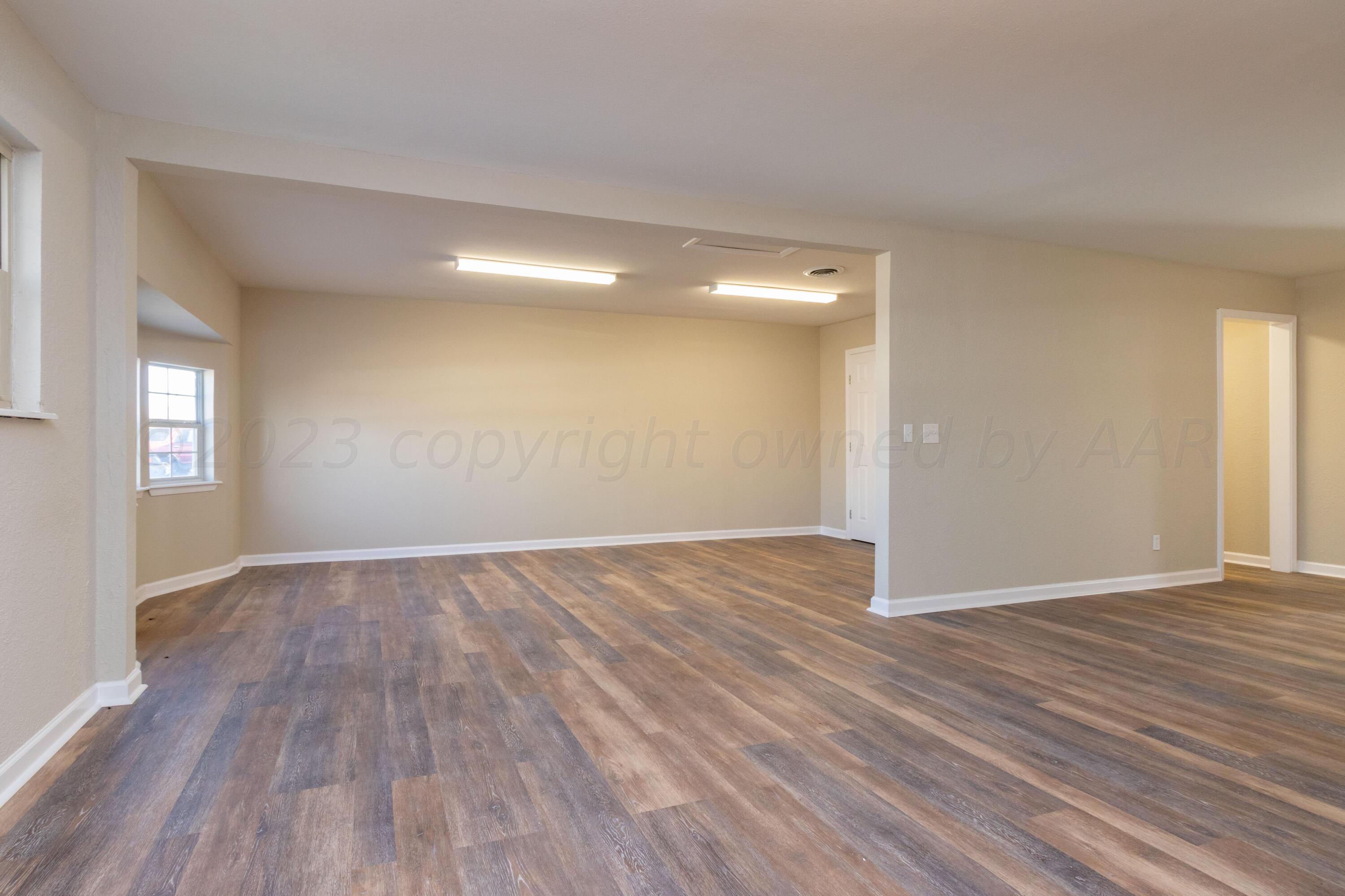 1612 Heather Street Amarillo, TX 79107 - Photo 3 of 31 living room to game room