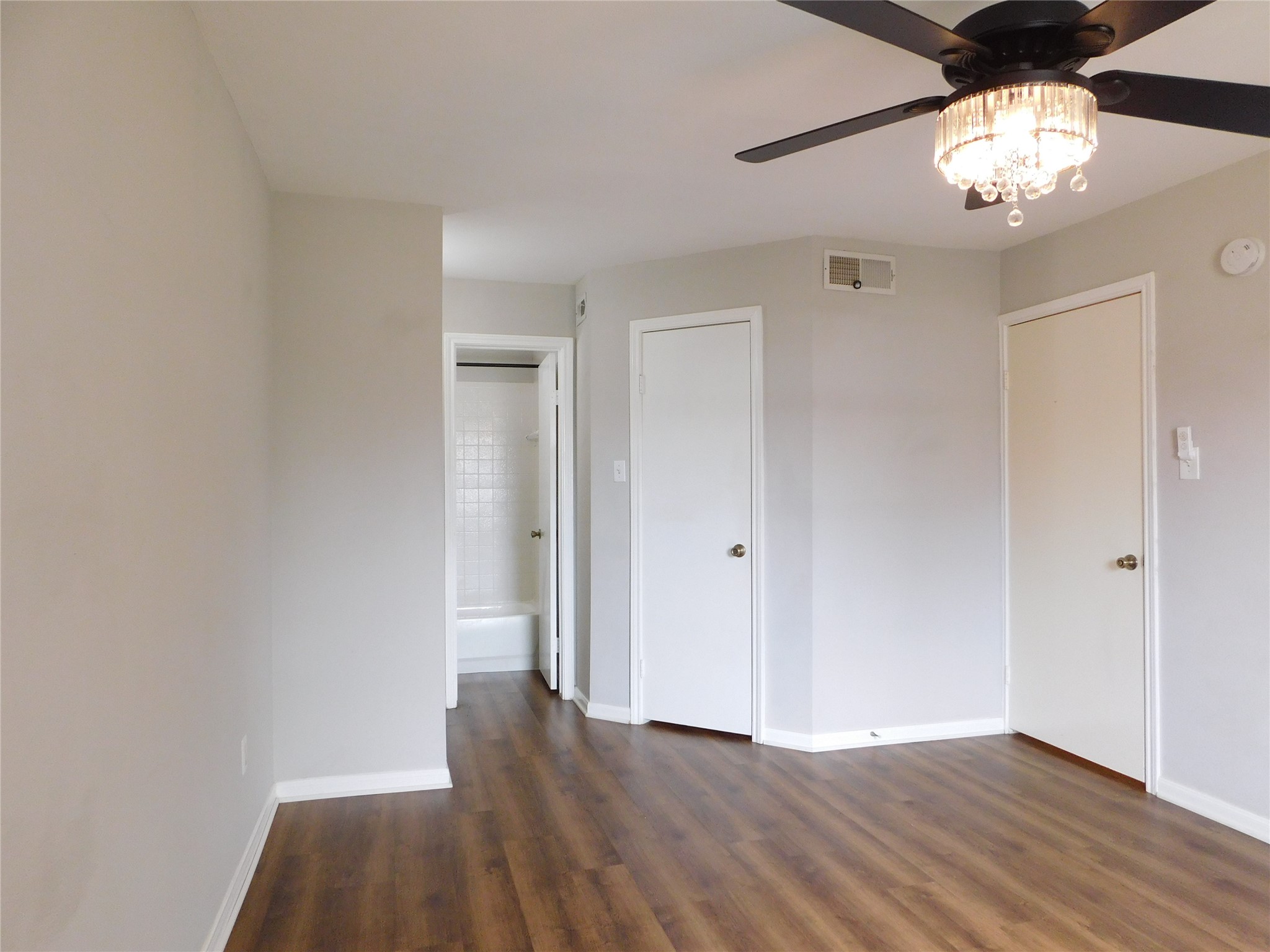 10101 South Gessner Road, Unit 912 Houston, TX 77071 - Photo 21 of 47 wooden floor in an empty room with a window
