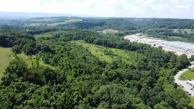 an aerial view of a house with mountain view