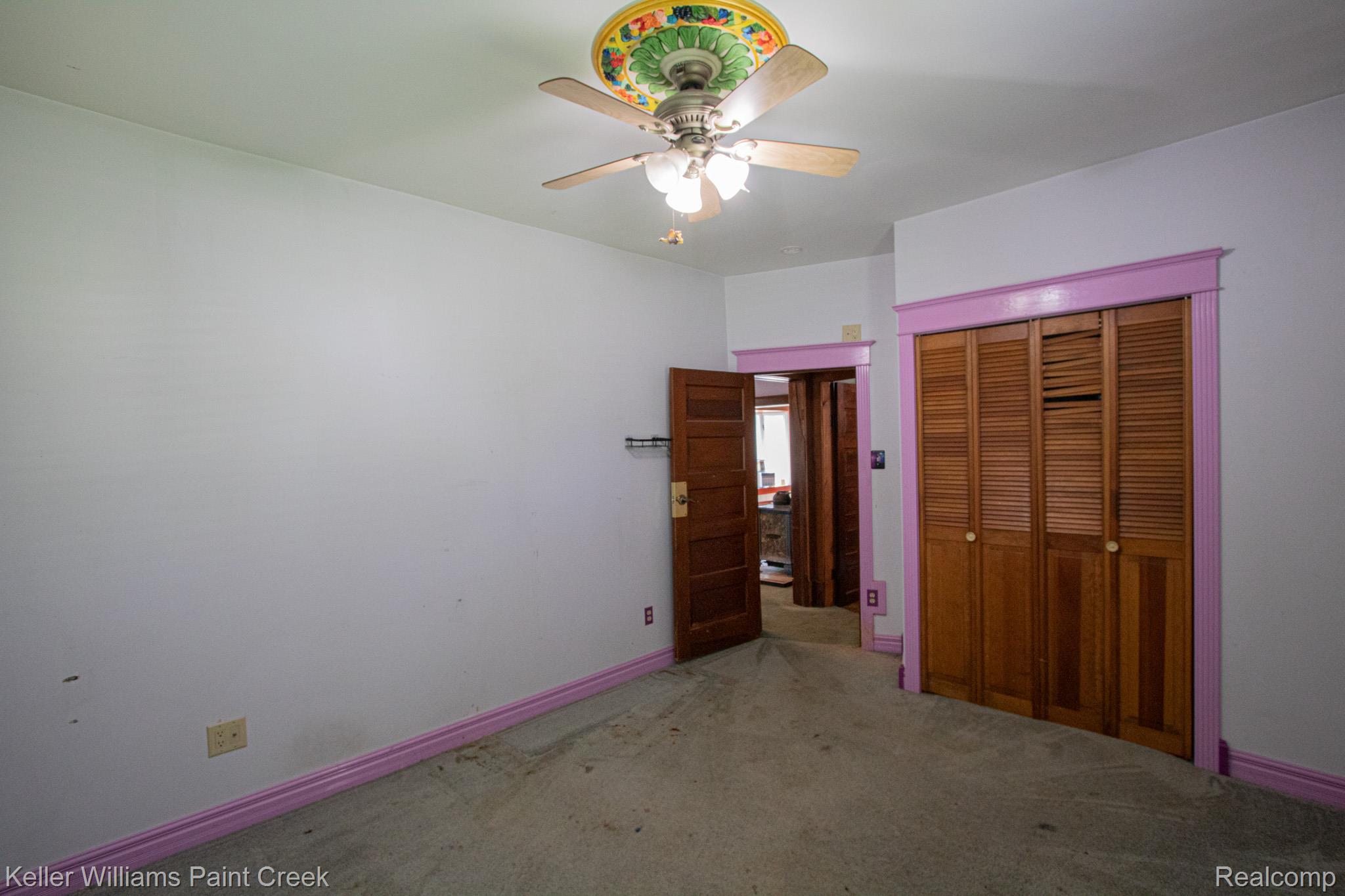2165 Michigan Road Port Huron, MI 48060 - Photo 14 of 38 Unfurnished bedroom with a closet, carpet flooring, and a ceiling fan