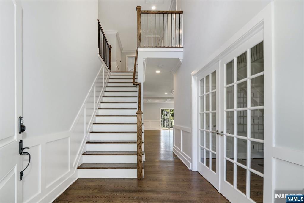28 Bennington Road Livingston, NJ 07039 - Photo 21 of 38 a view of entryway with wooden floor and stairs