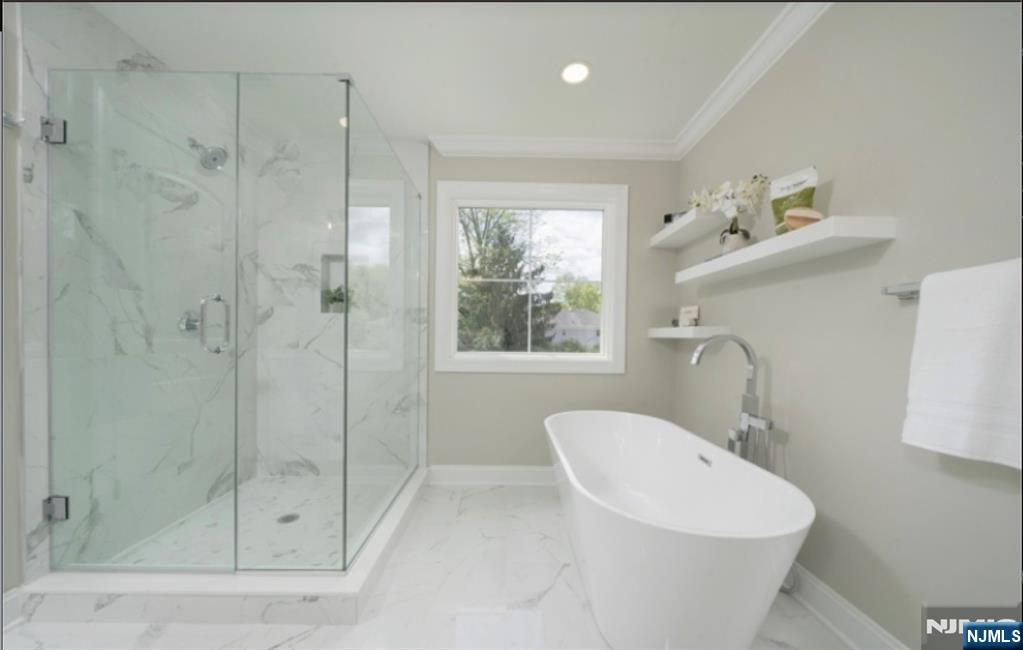 28 Bennington Road Livingston, NJ 07039 - Photo 28 of 38 a bathroom with a sink a toilet and shower