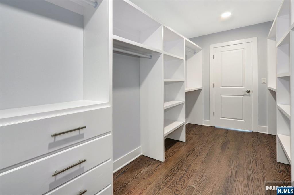 28 Bennington Road Livingston, NJ 07039 - Photo 31 of 38 a view of walk in closet with empty racks