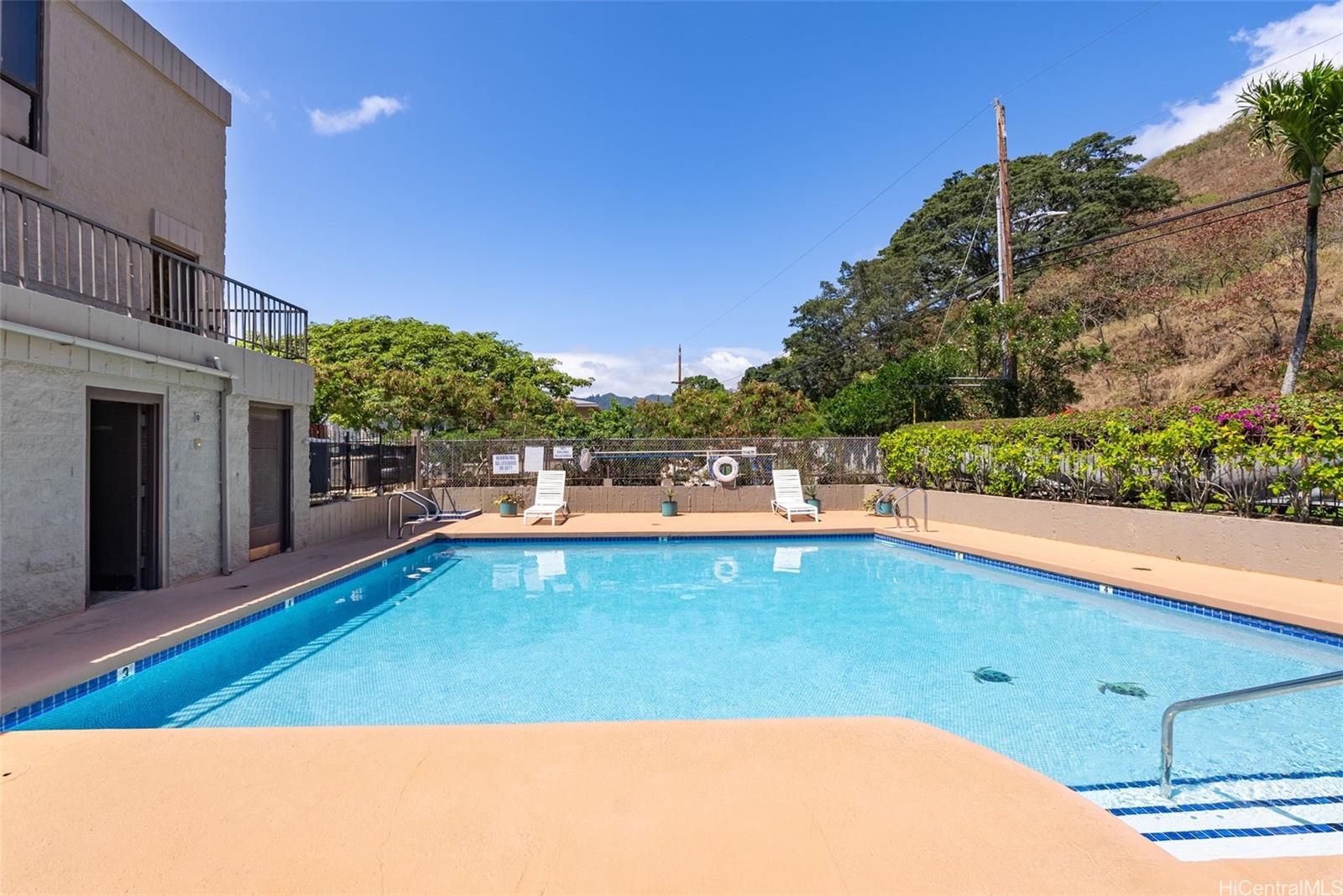 217 Prospect Street, Unit M10 Honolulu, HI 96813 - Photo 19 of 25 a view of a swimming pool with an outdoor seating and a yard