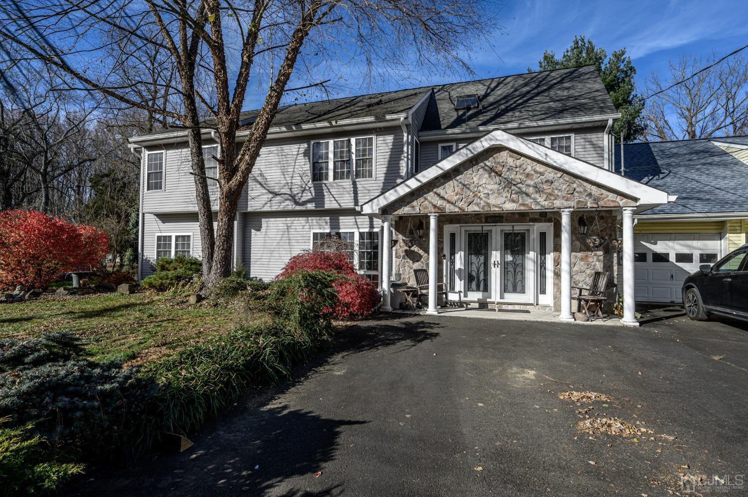 16 Pine Drive Roosevelt, NJ 08555 - Photo 1 of 1 a front view of a house with a garden