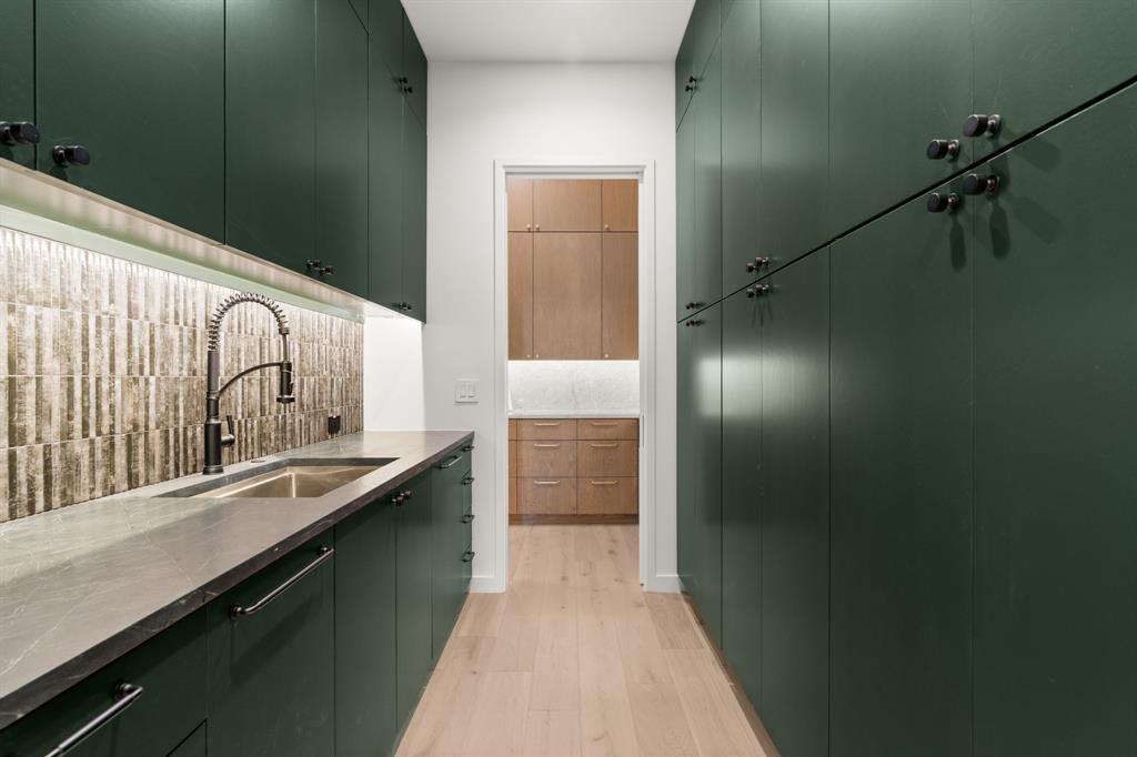 5908 Bull Creek Road Austin, TX 78757 - Photo 15 of 36 This butler's pantry includes another dishwasher, sink and plenty of storage.