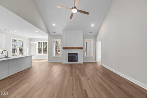 a view of a kitchen and a sink dishwasher wooden floor