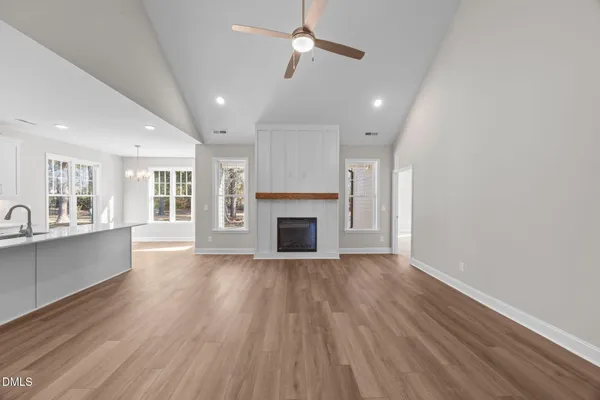 a view of a kitchen and a sink dishwasher wooden floor