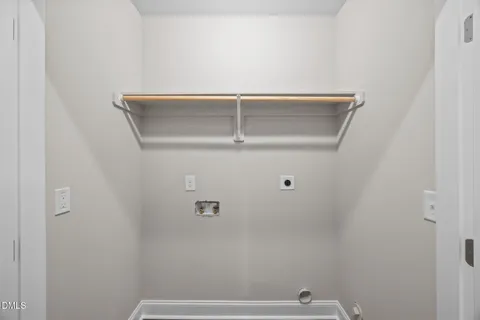 an empty room with closet and ceiling fan