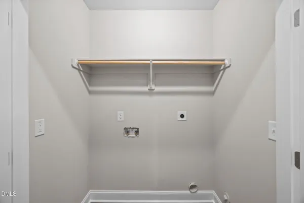 an empty room with closet and ceiling fan