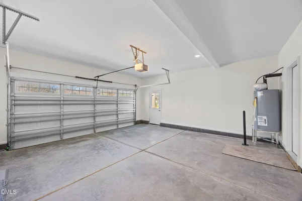 a view of an empty room with a ceiling fan