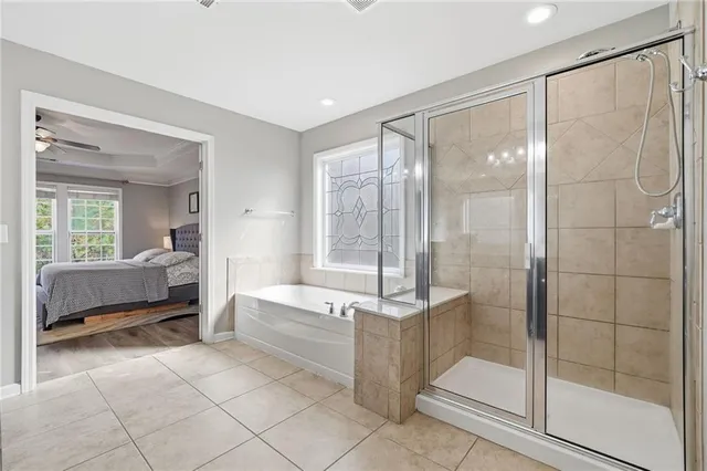 a bedroom with bed and a window