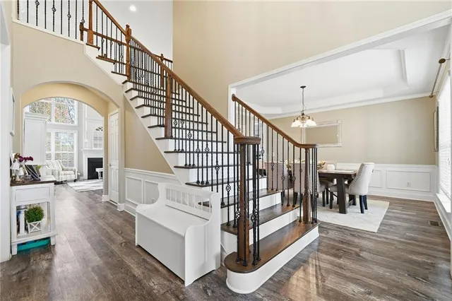 a view of entryway livingroom and hall with wooden floor