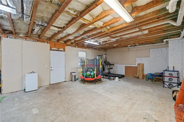 an aerial view of residential house with outdoor space and parking