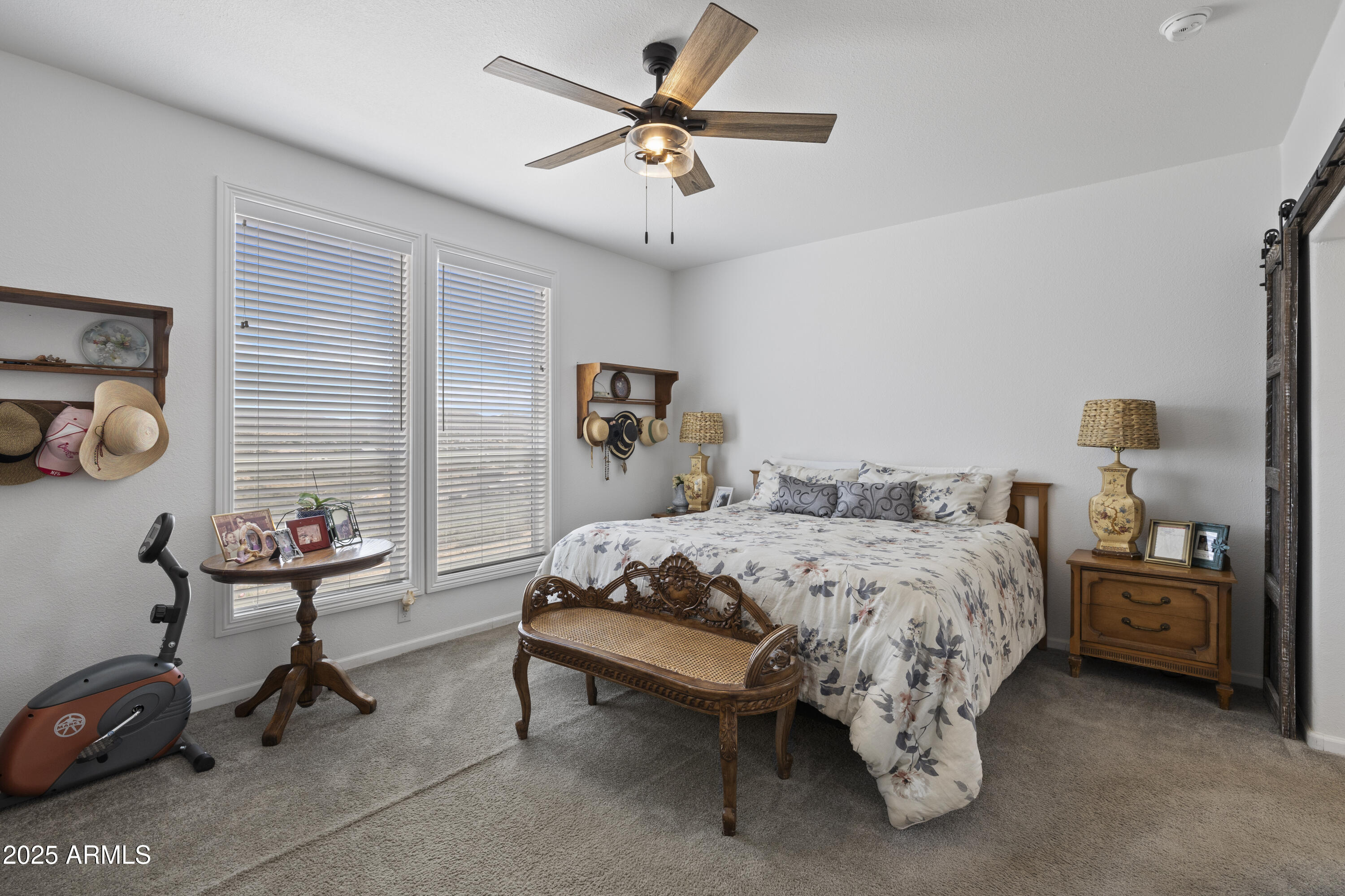 1235 North Harvest Road Dewey, AZ 86327 - Photo 11 of 37 a bedroom with a bed and a chandelier