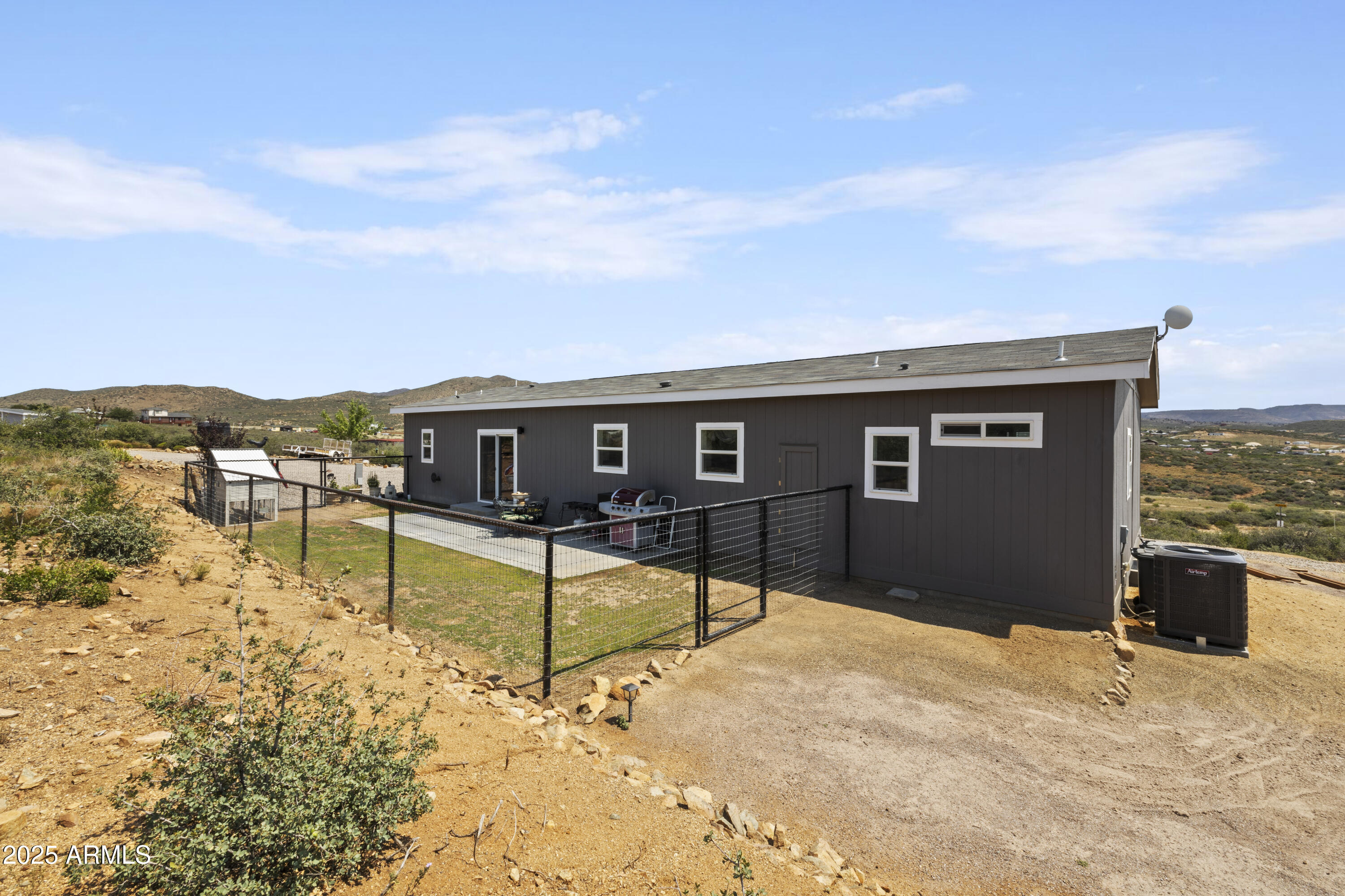 1235 North Harvest Road Dewey, AZ 86327 - Photo 21 of 37 a front view of a house with a yard