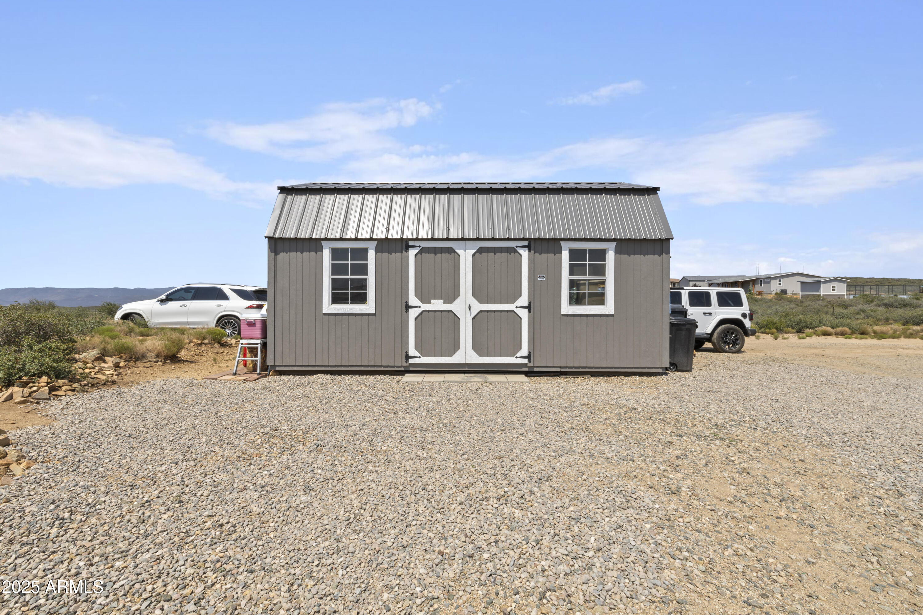 1235 North Harvest Road Dewey, AZ 86327 - Photo 23 of 37 a front view of a house with a yard and garage