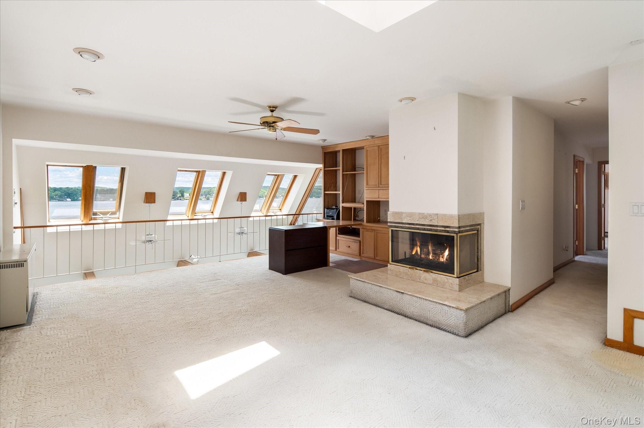 41 Tamarack Road Mahopac, NY 10541 - Photo 30 of 41 The third floor bonus room with fireplace, wet bar, and skylights overlooking Lake Mahopac