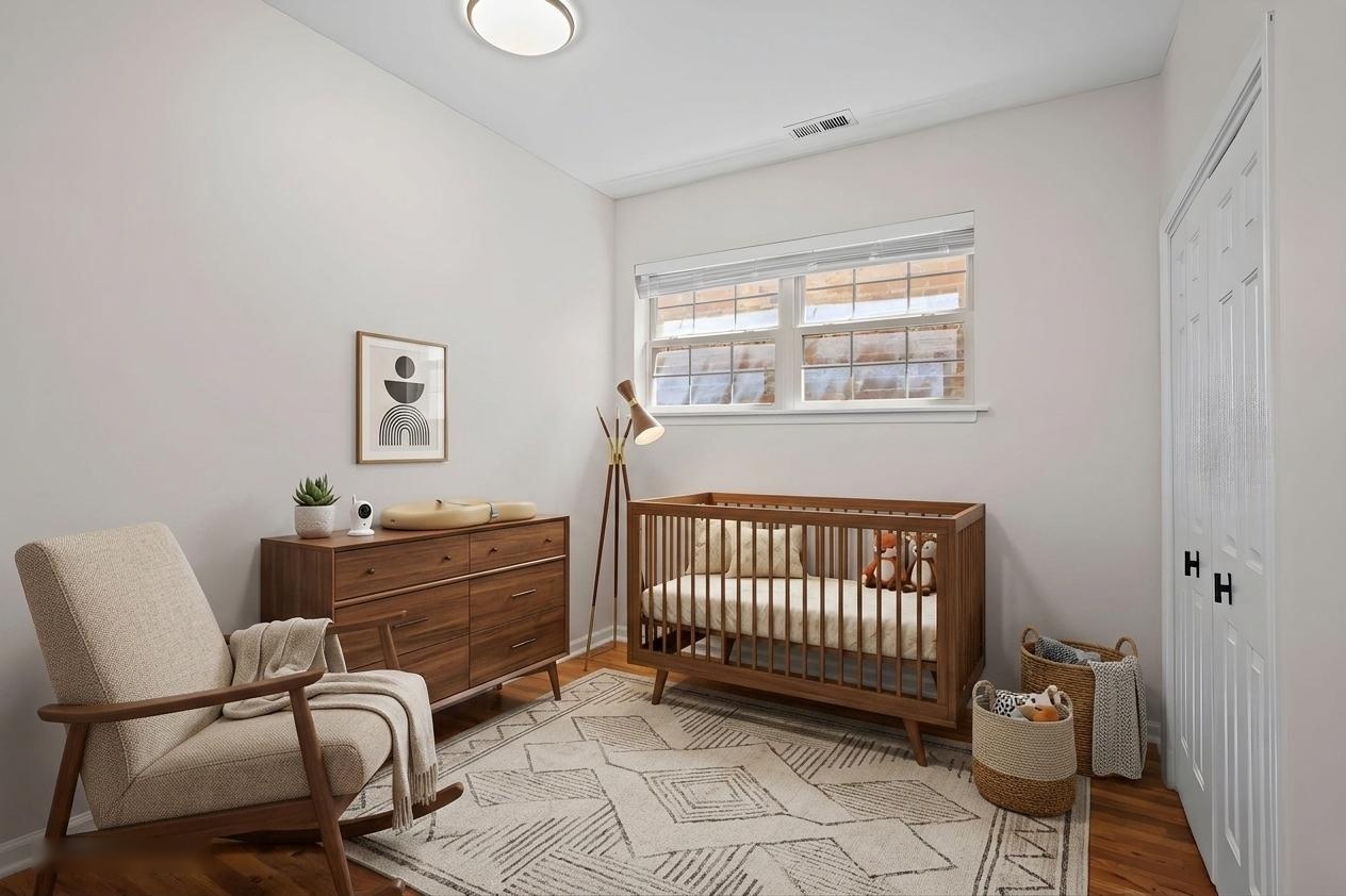 2710 West Haddon Avenue, Unit 2 Chicago, IL 60622 - Photo 7 of 11 a bedroom with a bed and a window