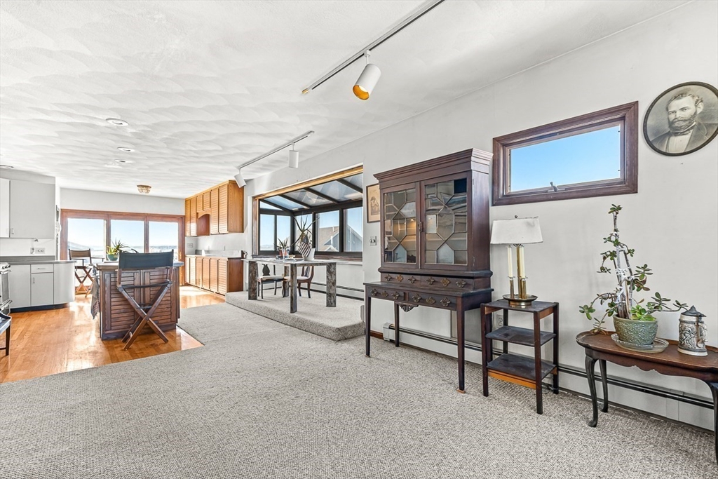 47 Prospect Avenue, Unit 47 Winthrop, MA 02152 - Photo 21 of 31 a living room with furniture and a table