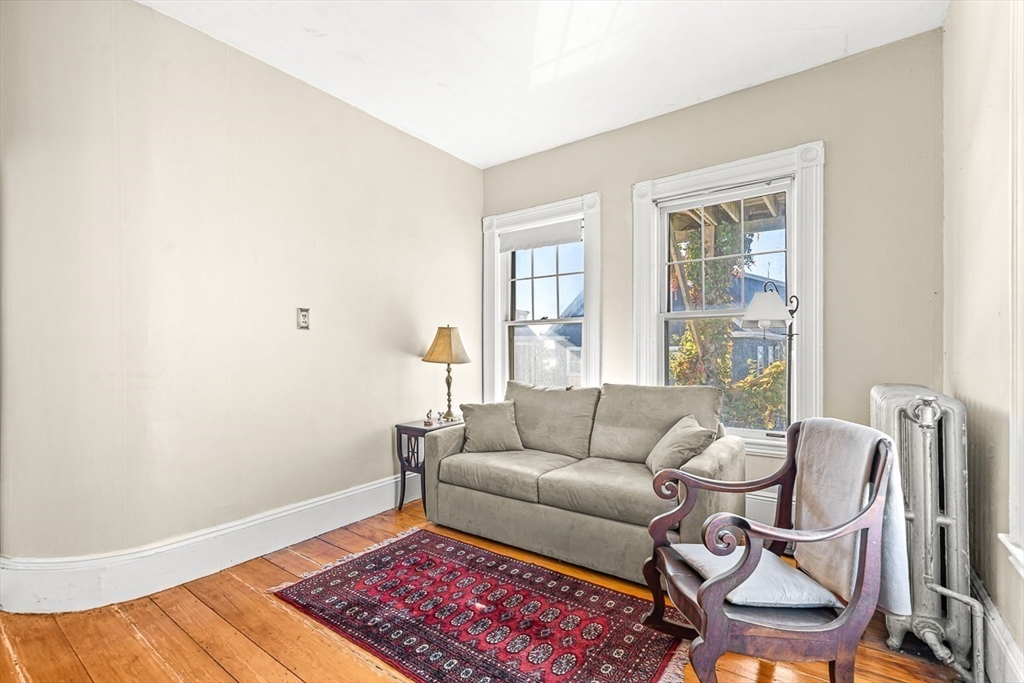 47 Prospect Avenue, Unit 47 Winthrop, MA 02152 - Photo 24 of 31 a living room with furniture and a rug