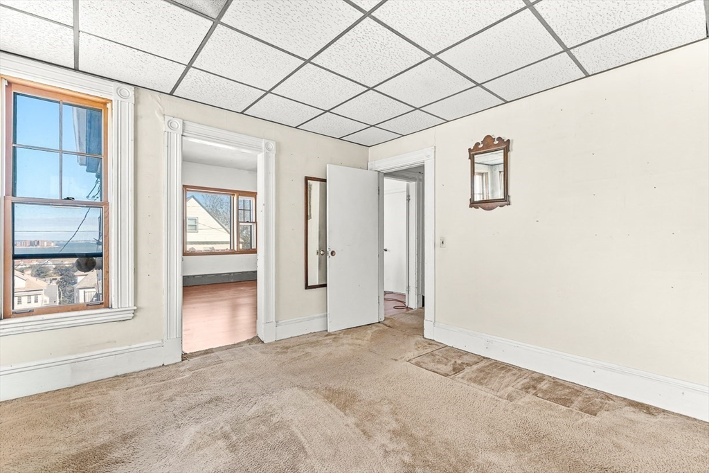 47 Prospect Avenue, Unit 47 Winthrop, MA 02152 - Photo 27 of 31 an empty room with windows