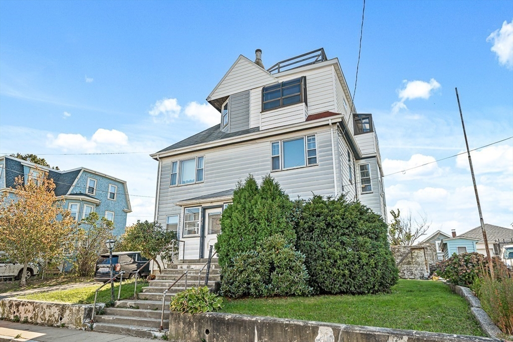 47 Prospect Avenue, Unit 47 Winthrop, MA 02152 - Photo 31 of 31 a front view of a house with a yard