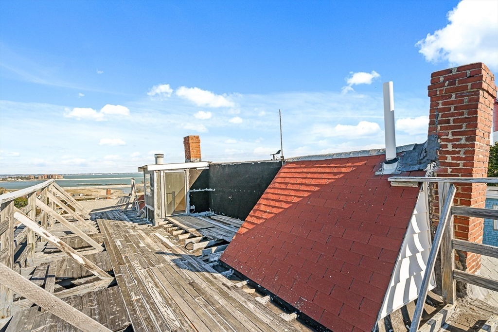 47 Prospect Avenue, Unit 47 Winthrop, MA 02152 - Photo 9 of 31 a terrace with outdoor seating and city view